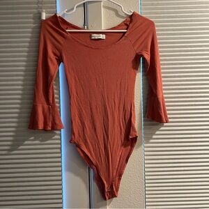 abercrombie and fitch bodysuit size small in a rust/salmon color worn once